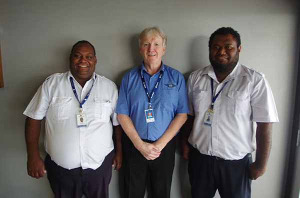 Solomon Airlines pilots with trainer